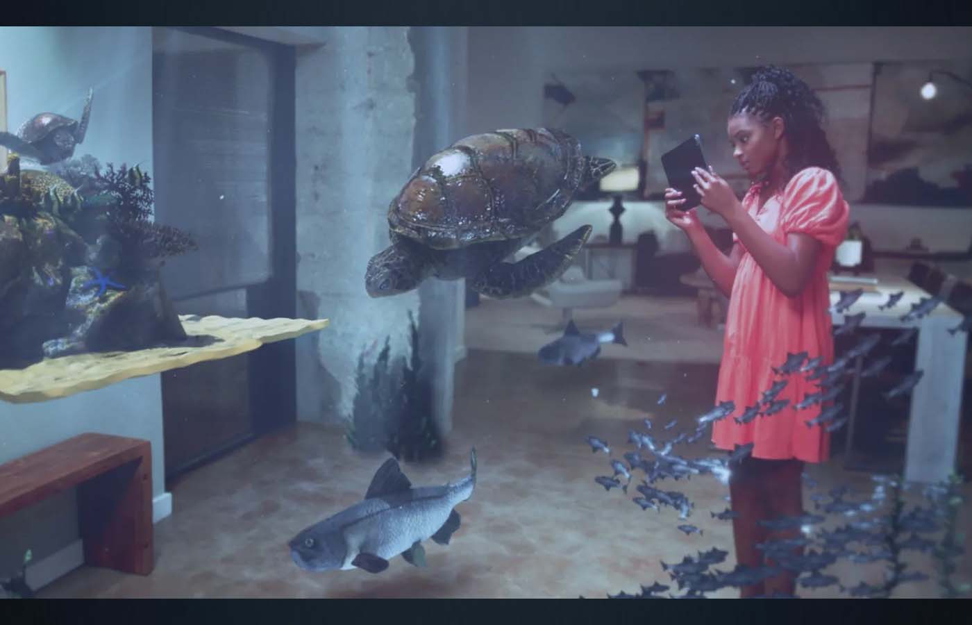 woman in gallery seeing augmented reality underwater life