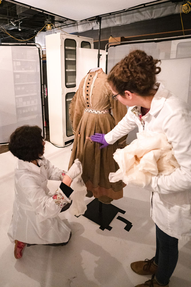 "conservation staff preparing a gymsuit for 3d capture"